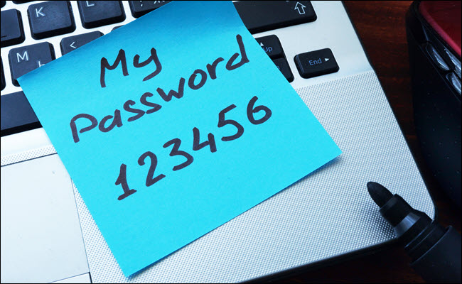 My Password123456 written on a post-it note and stuck to a computer.